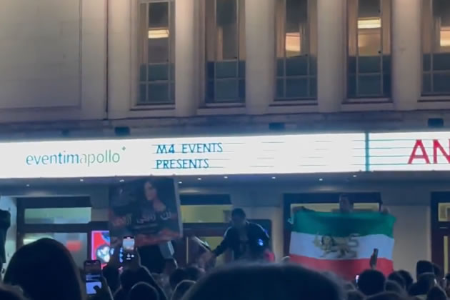 Banners and flags held up by protestors